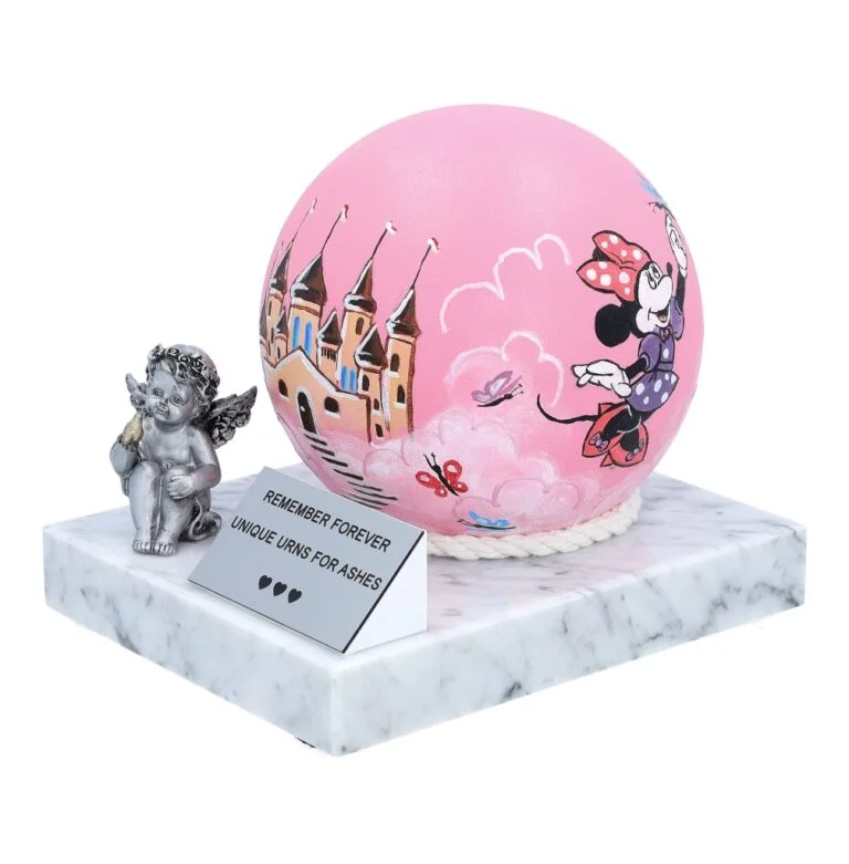 Hand-painted stainless steel baby girl urn on a marble base