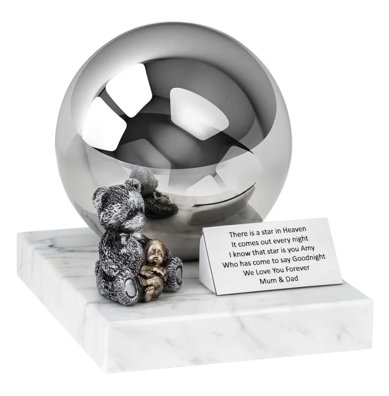Teddy Bear child cremation urn with a stainless steel sphere and figurine on a marble base