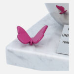 pink butterfly on the memorial urn for a child