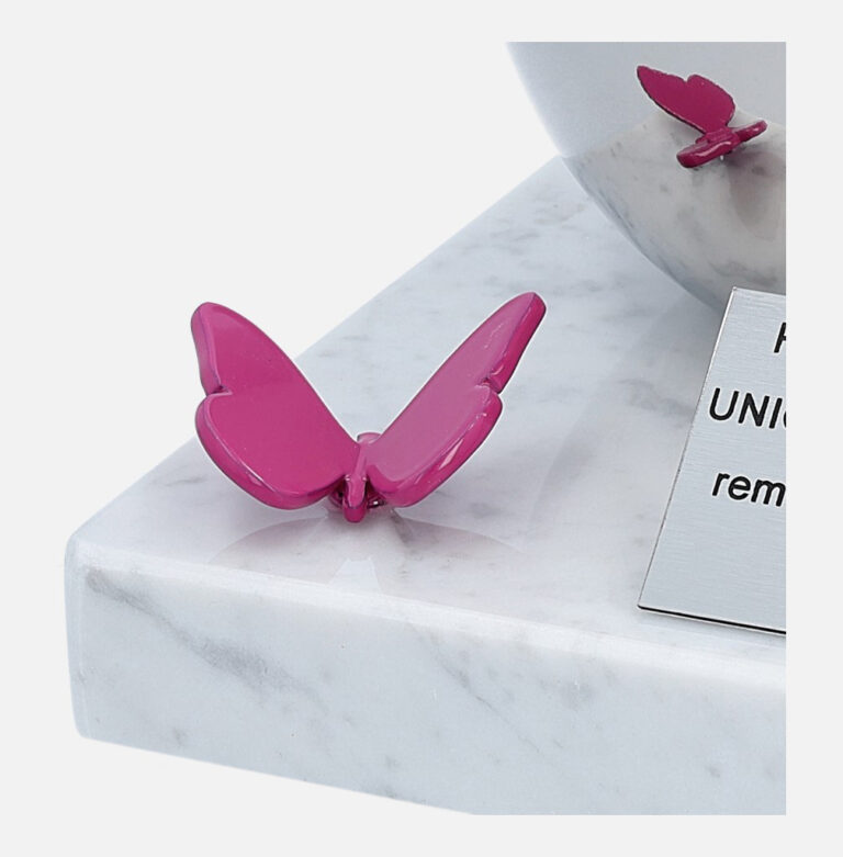pink butterfly on the memorial urn for a child