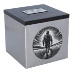 Funeral urn with engraving of soldier walking through a field at sunset