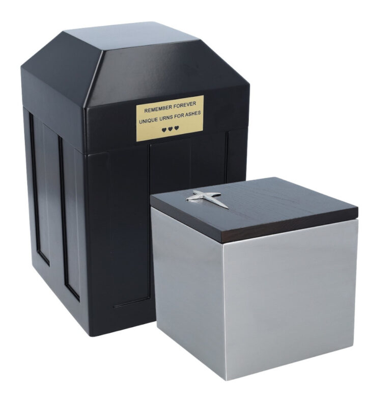 Vault with nameplate and stainless-steel urn with cross on the lid.