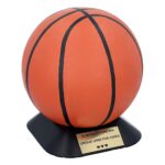 Hand-painted basketball cremation urn on a black base with a memorial plaque.