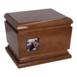 Angled view of solid wooden cremation urn