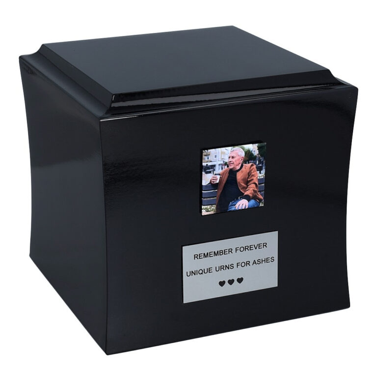Black wooden cremation urn with photo and memorial plaque