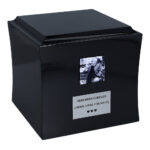 Black wooden urn with black and white photo