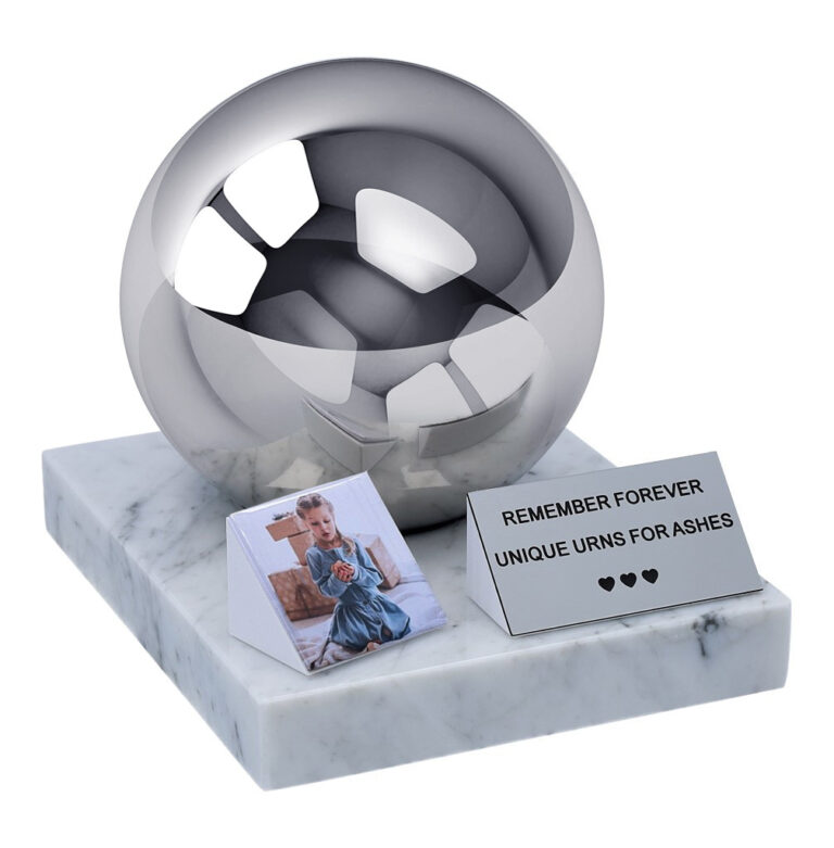 Stainless steel spherical child urn on marble base with memorial plaque and photo tile