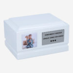 White wooden child urn with photo and memorial plaque – front view