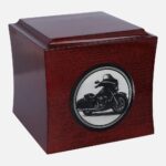 Wooden urn with Harley-Davidson motorcycle engraving, side view.