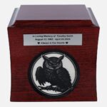 Cremation urn with owl engraving and “In Loving Memory” plaque, centered view.