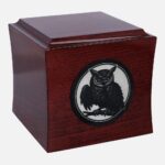 Wooden owl urn, side view.
