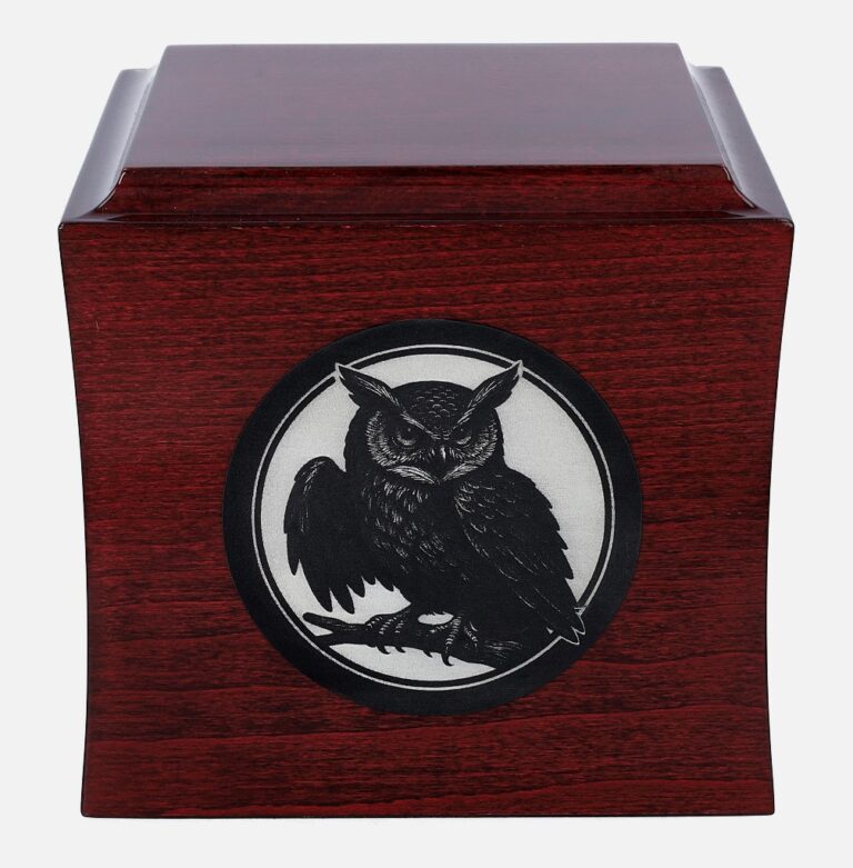 Cremation urn with owl engraving, front view.