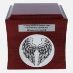 Urn front: angel wings engraving with memorial nameplate above.