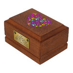 Wooden Pet Cremation Urn with colorful heart of paw prints, side perspective.
