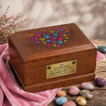 Wooden Pet Cremation Urn – Colorful Paw Print Heart Memorial Urn displayed in an elegant memorial setting.