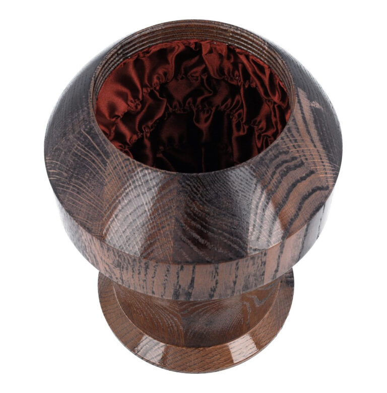 Interior of dark brown oak cremation urn lined with soft fabric