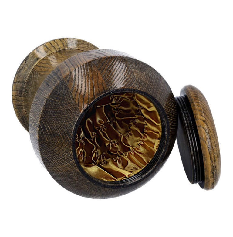 Interior of premium gold oak cremation urn with soft fabric lining.