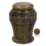 Close-up of premium golden oak wood grain cremation urn.
