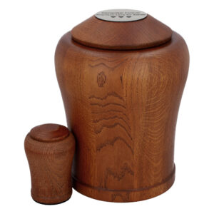 Solid oak wooden urn for human ashes with matching keepsake urn in walnut finish.