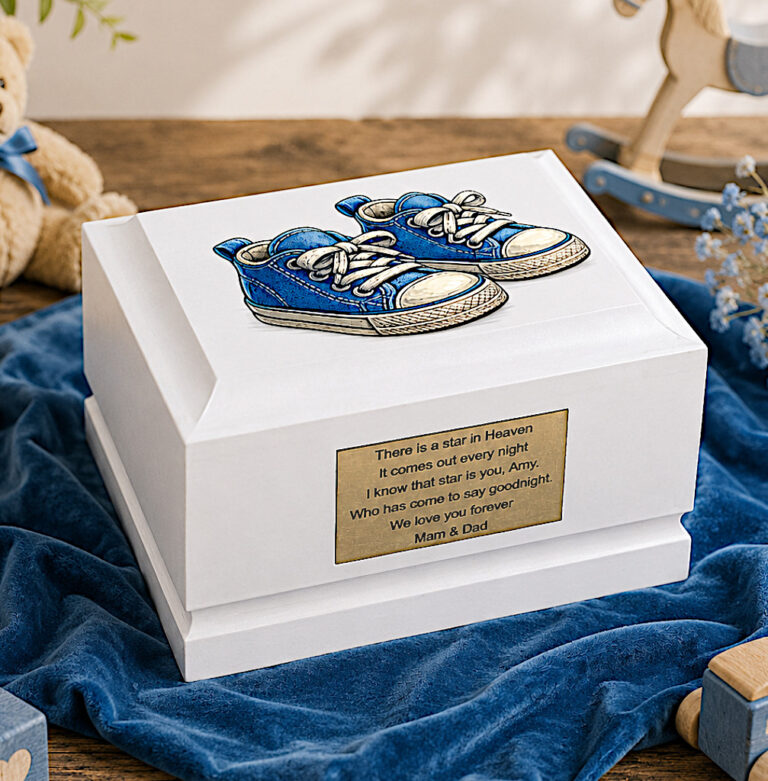 White Wooden Child Cremation Urn with Blue Baby Shoes Displayed in a Peaceful Memorial Setting
