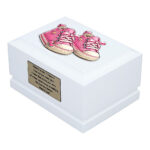 White Wooden Child Memorial Urn with Pink Baby Shoes Design – Angled View