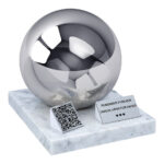 Adult urn with QR code featuring a polished sphere, white marble base, memorial plaque and QR code plaque.