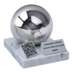 Child urn with QR code featuring a polished sphere, white marble base, memorial plaque and QR code plaque.